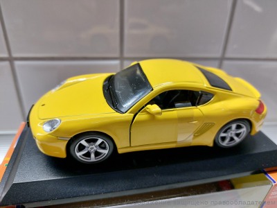 Коллекционная модель Porsche Cayman S 1:32 Bburago